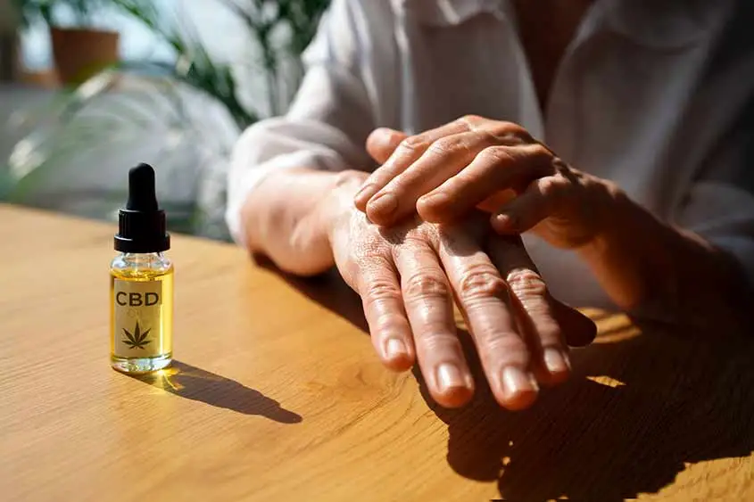 CBD oil being applied on a hand.