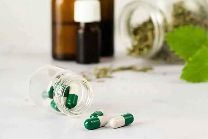 Marijuana pills with out of focus products in background