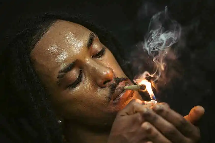 Rastafarian lighting up a joint