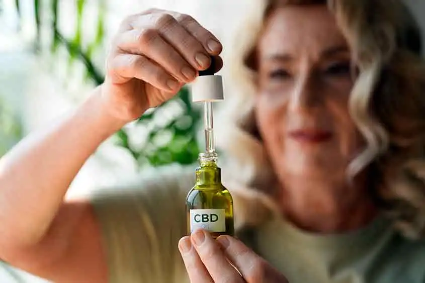 Middle aged lady using CBD oil