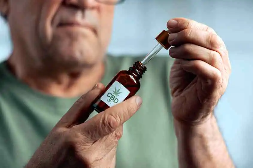 Elderly gentleman using CBD oil