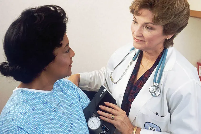 Lady doctor with a patient